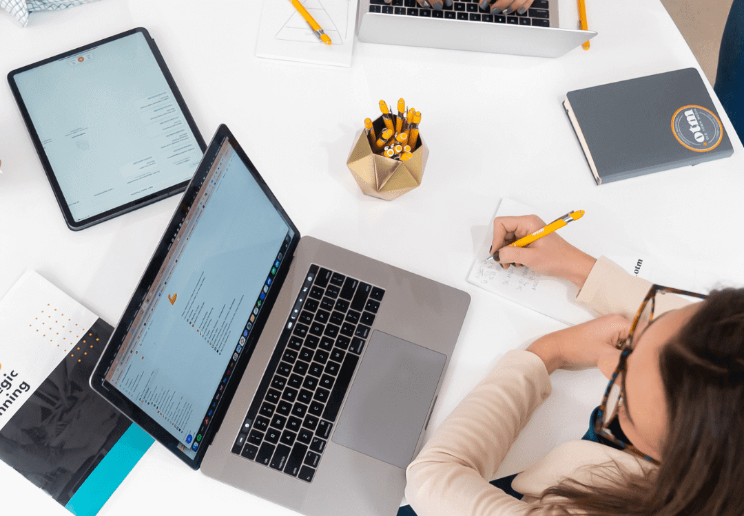 Woman at a table with a notepad Woman at a table with a notepad